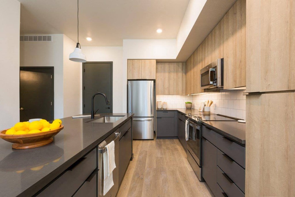 Model kitchen with dark, designer  cabinetry
