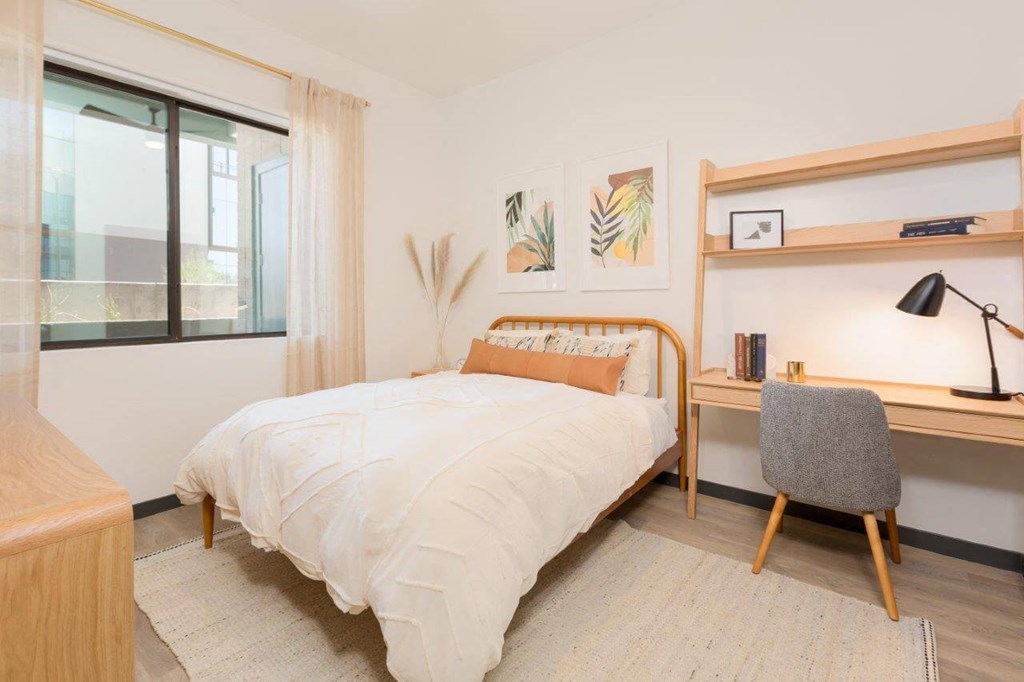 Model bedroom with large window for natural lighting
