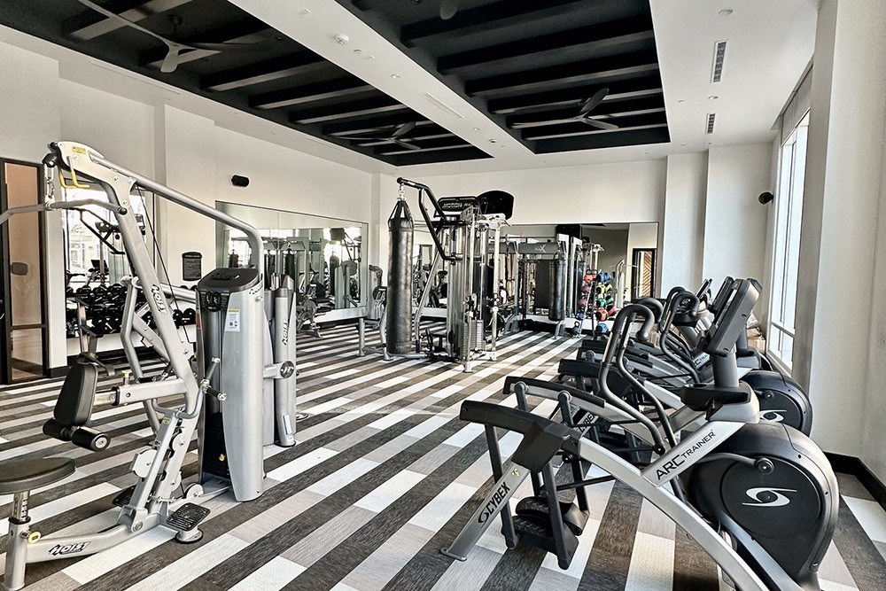 a gym with cardio machines and other exercise equipment