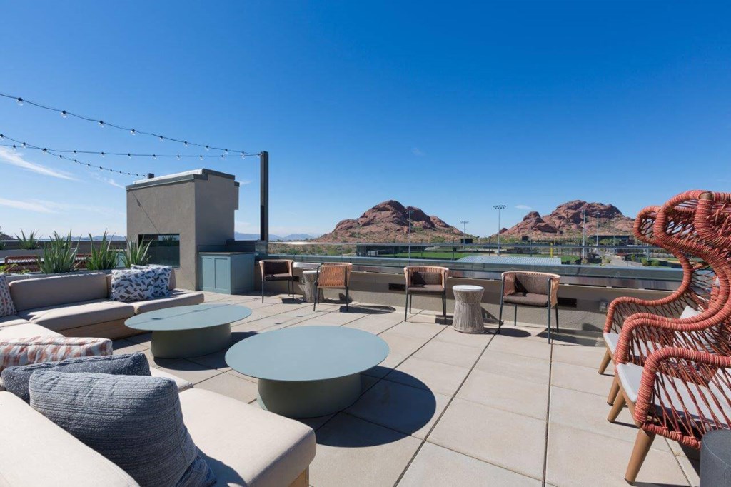 Roof top lounge with view of red-rock mountains