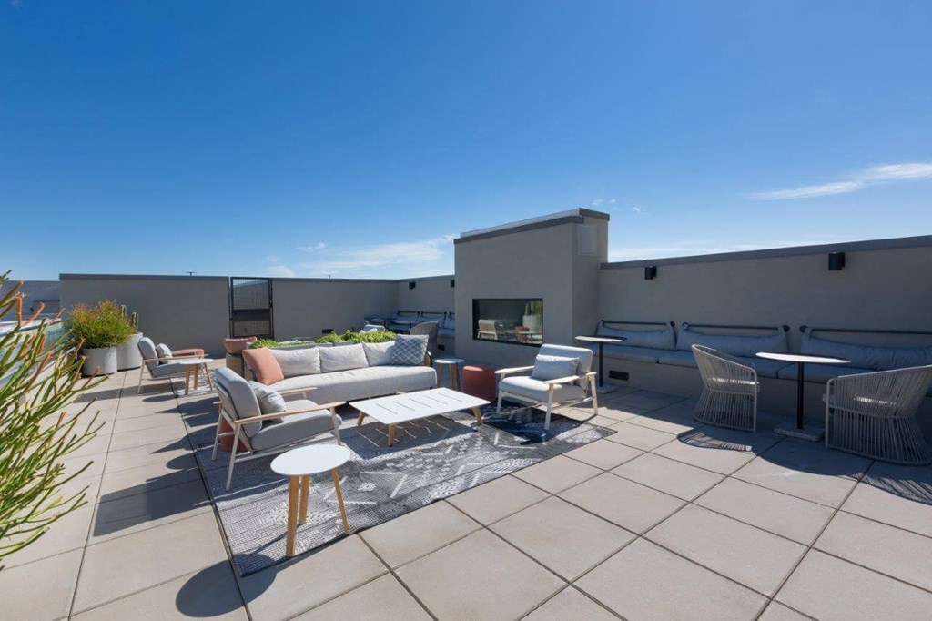 Rooftop lounge with tables and lounge chairs
