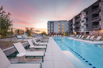 Swimming pool with loungers surrounding - Photo Gallery 3