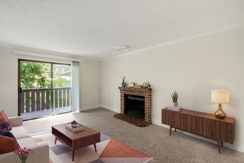 A living room with a fireplace and a couch.