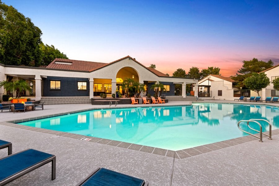 a swimming pool in front of a house with a resort style pool at Lore South Mountain, Phoenix, AZ