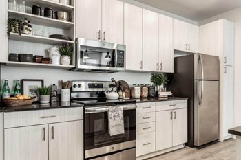 Model kitchen with updated stove and microwave