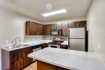 Model kitchen with dark wood cabinetry - Photo Gallery 4