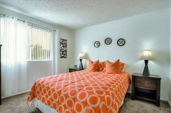 Model bedroom with queen-size bed
