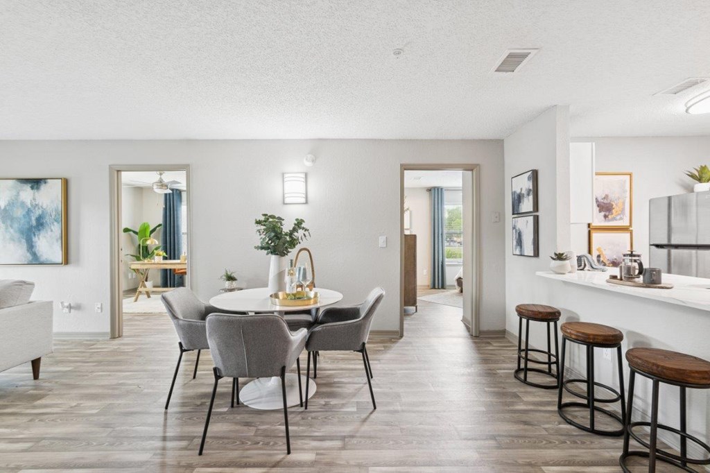 Model kitchen and dining at Mirage on Kernan Apartments in Jacksonville, FL