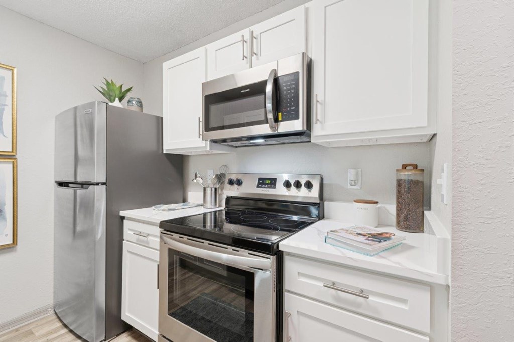 Model kitchen with stainless steel appliances at Mirage on Kernan Apartments in Jacksonville, FL