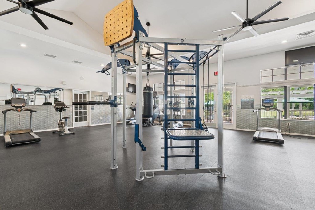 Fitness center with weightlifting equipment at Mirage on Kernan Apartments in Jacksonville, FL