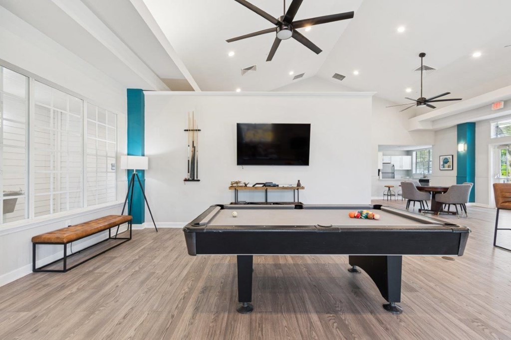 Resident lounge with TV and billiards table at Mirage on Kernan Apartments in Jacksonville, FL
