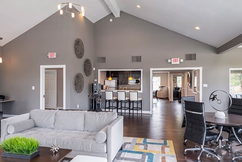 A living room with a grey couch and a coffee table.