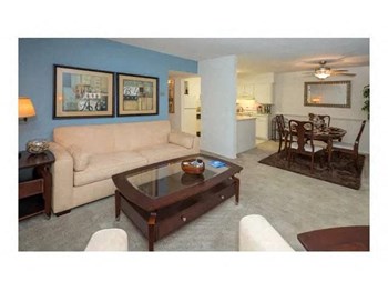 Model living room with view of dining area