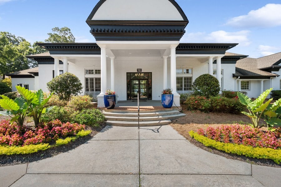 a large white building with a black door