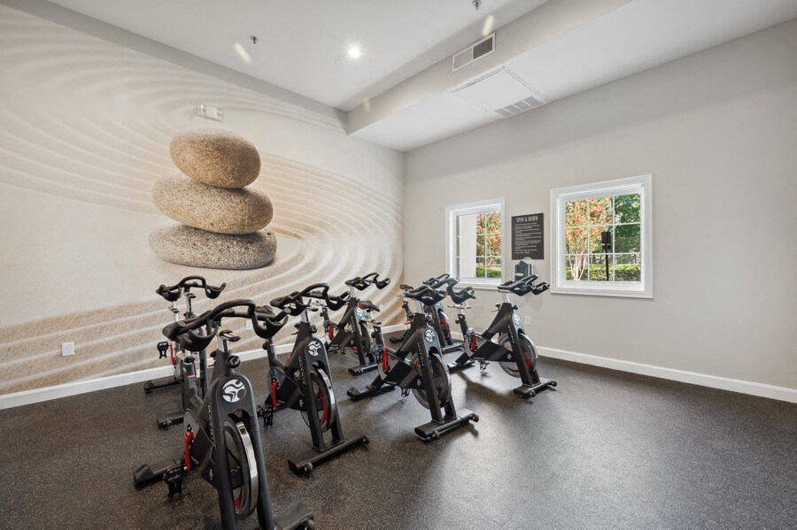 a room filled with lots of bikes and a circular structure in the middle of the room