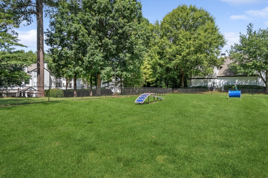a large grassy area with a hurdle in the middle of it