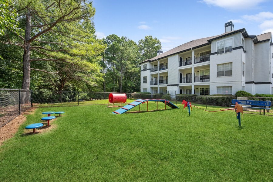 our apartments offer a dog park with a playground