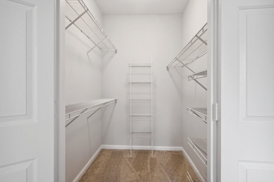 a walk in closet in a 555 waverly unit