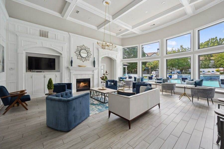 the estates at tanglewood|living room with fireplace and large windows