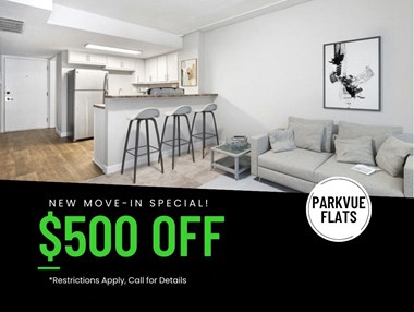 a living room and kitchen with a couch and stools, advertising a $500 move-in special