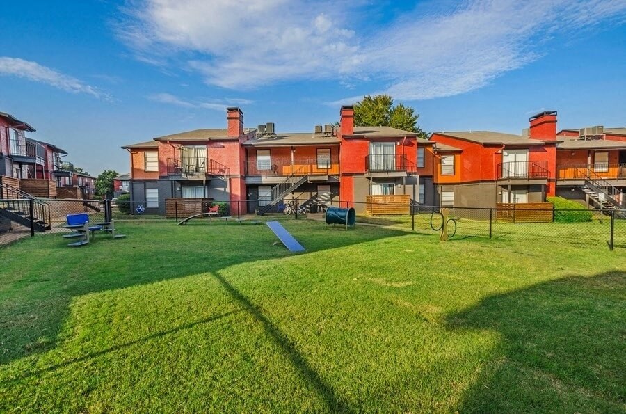 Fenced  dog park with agility equipment