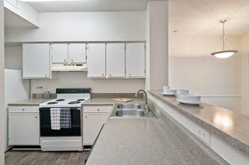 Kitchen with bar seating and new appliances