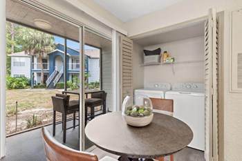 Dining area with view of laundry