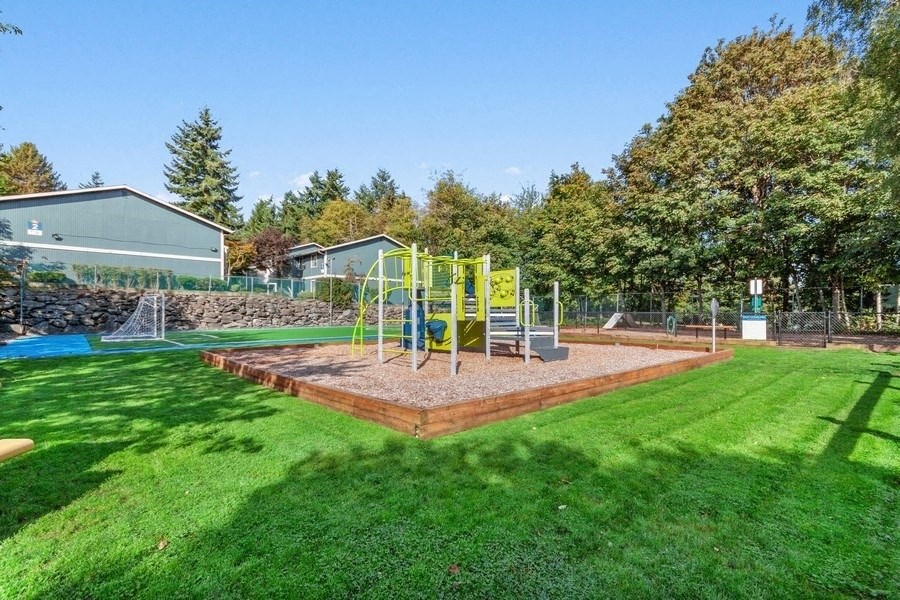 Playground park next to brand new soccer field and well kept landscape