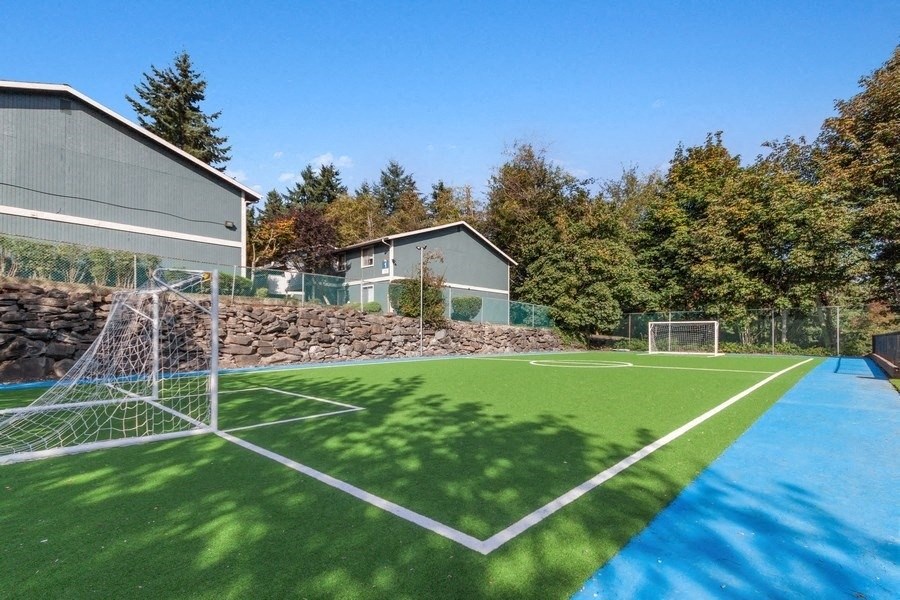 Newly renovated turf soccer field with painted lines and goalposts.
