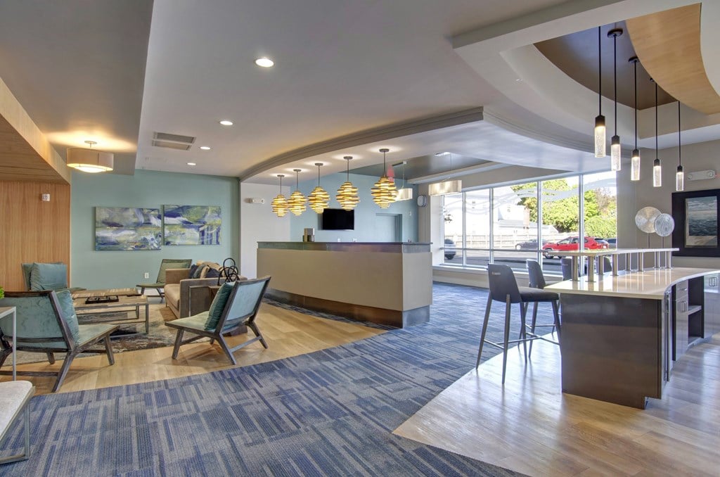 Community center with chairs, tables, and tv
