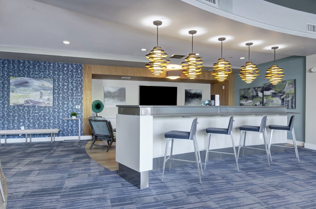 community room- chairs counter bench tv lighting