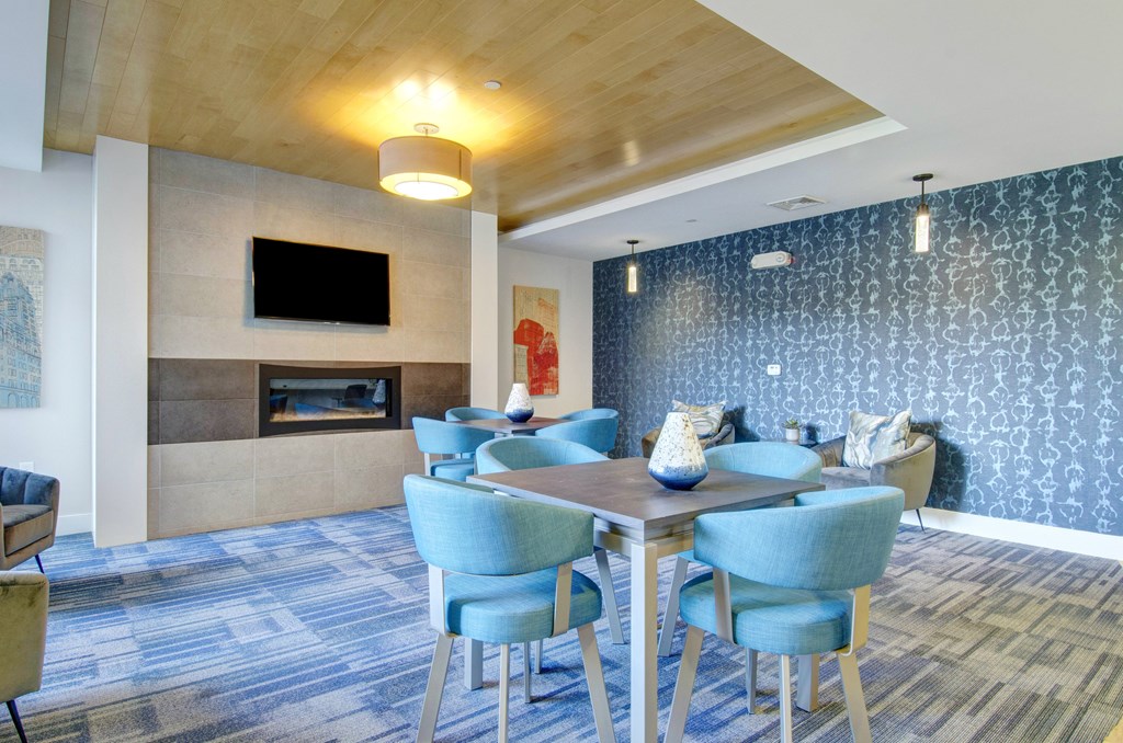 A conference room with a long table and chairs.