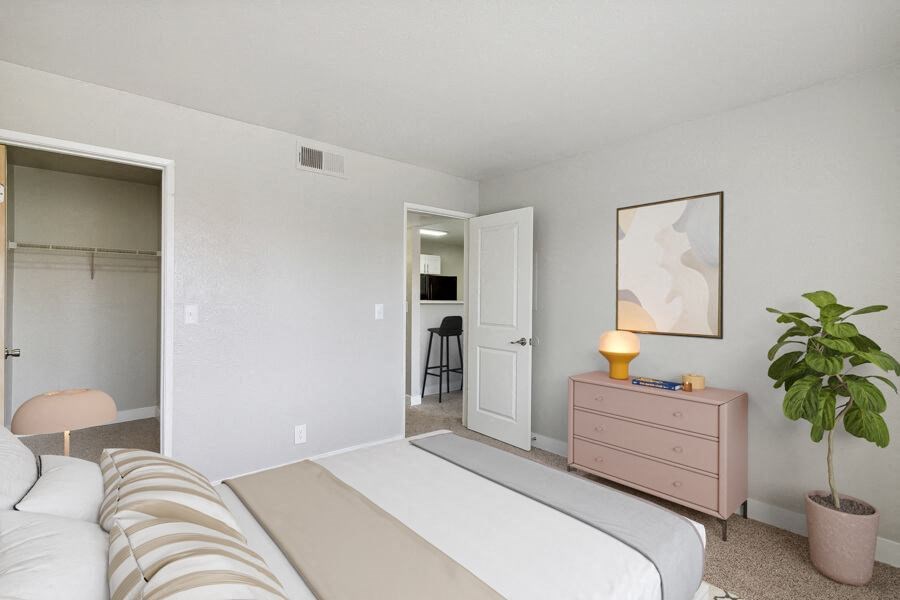 a bedroom with a bed and a dresser