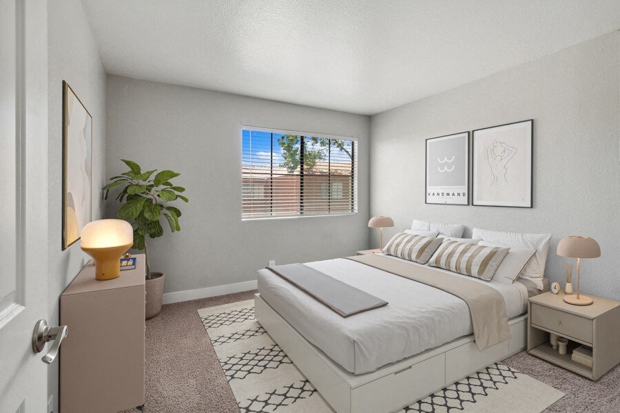 a bedroom with a bed and a window