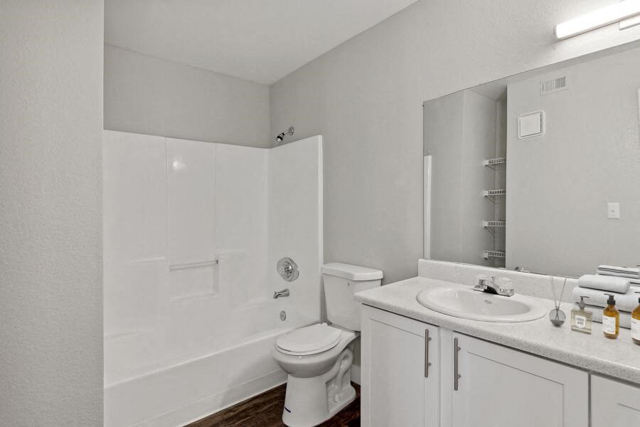 a bathroom with a toilet sink and bathtub