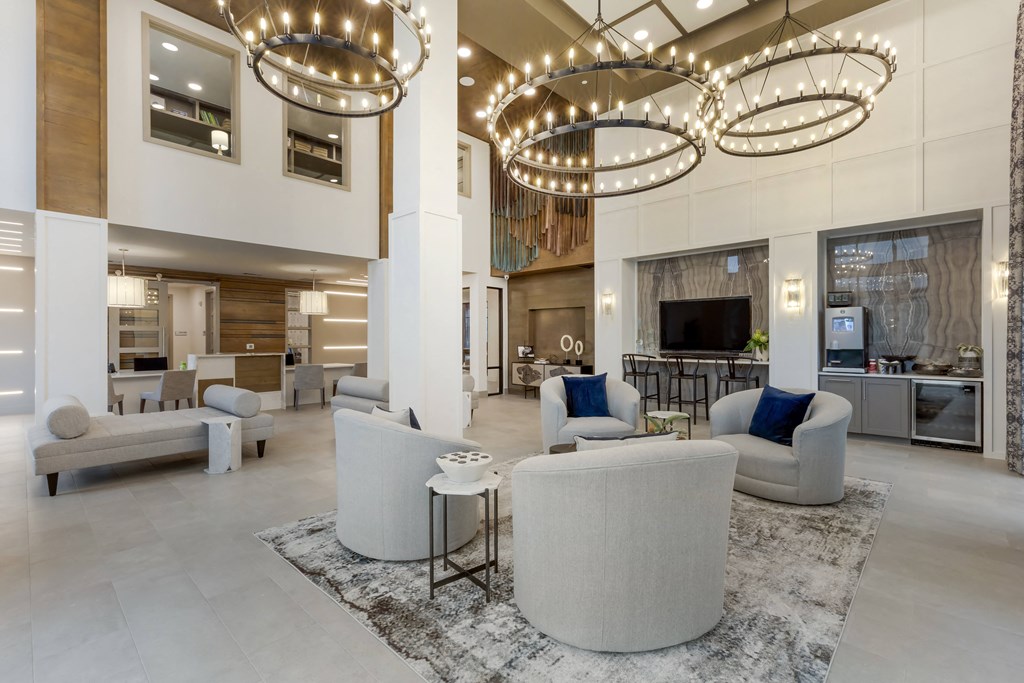 a living room filled with furniture and a large window