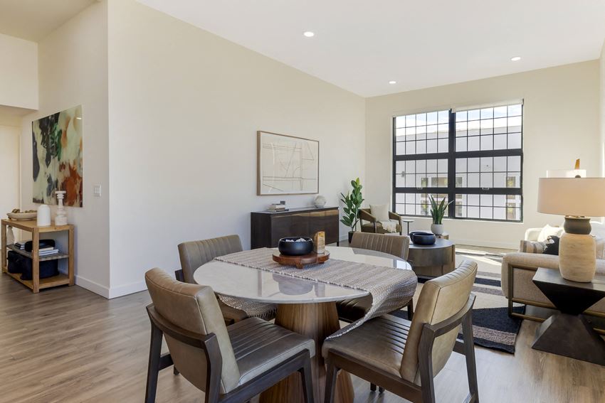 a dining room with a table and chairs
