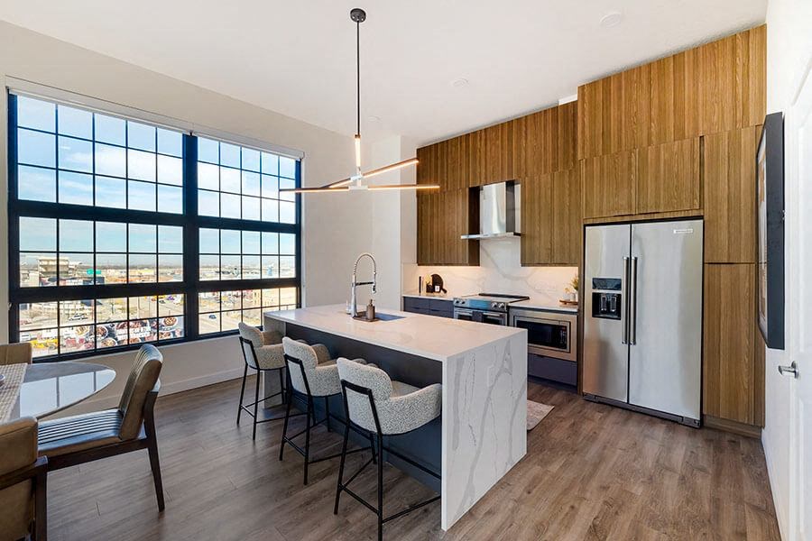 Model kitchen with island at The Register located in Post District Residences in downtown Salt Lake City, Utah
