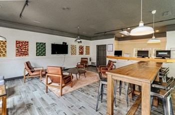 Clubhouse public computers and internet access with tables and chairs