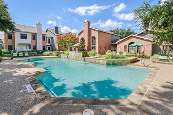 Swimming pool with beach chairs and right next community clubhouse