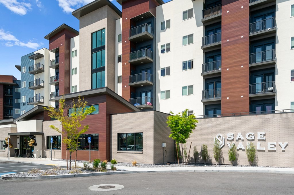 A modern apartment complex named Sage Valley is shown in the image.