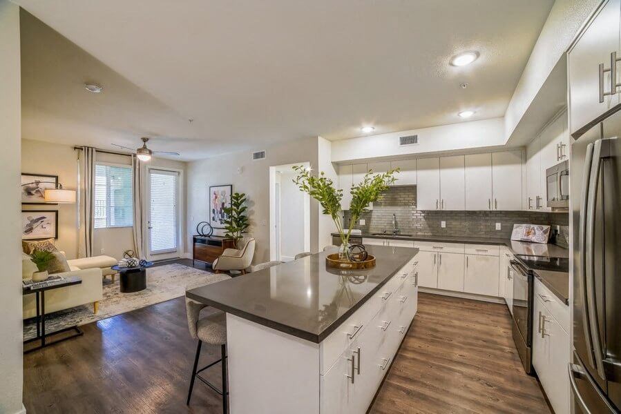 Model kitchen with white cabinetry and island