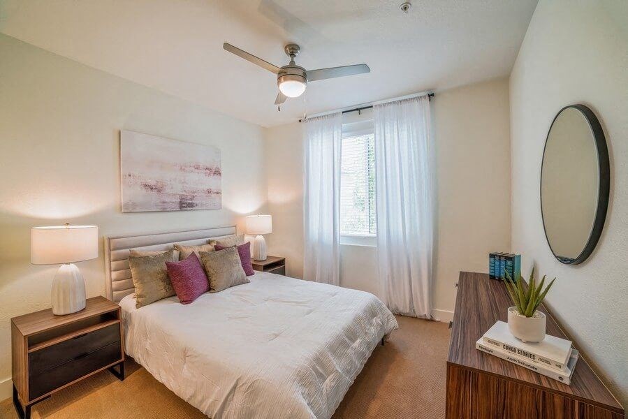 Model bedroom with carpeting and fan