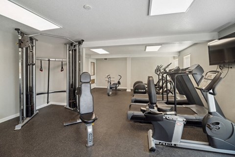 fitness center with exercise equipment