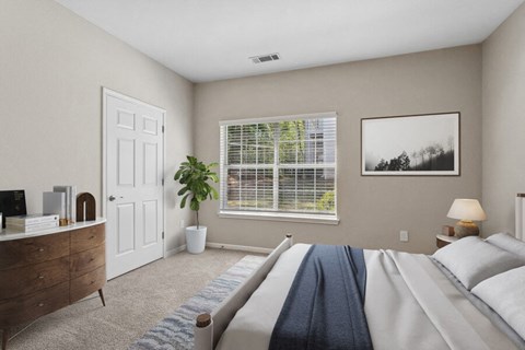 Bedroom with a large bed and a window