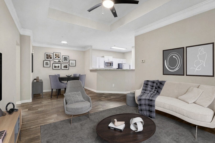 Model apartment living room with a couch and a table