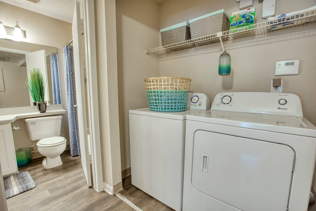 Washer and dryer in a laundry room at Huntington Place Apartments in Sarasota, Florida