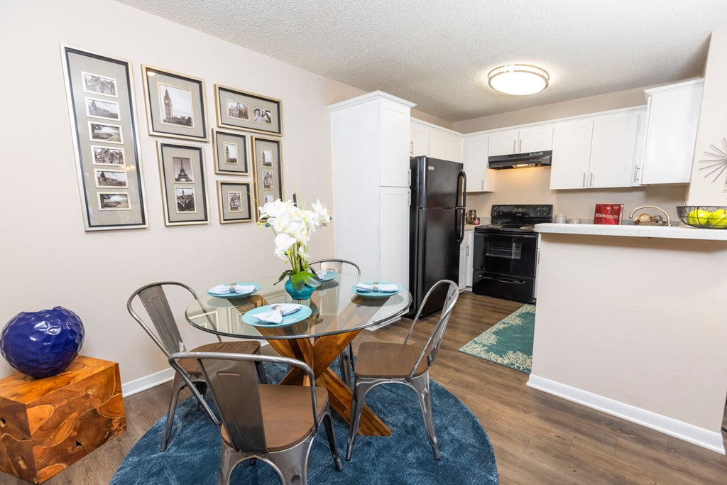 Dining room with a table and chairs  at Huntington Place Apartments in Sarasota, Florida