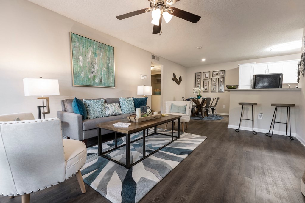Living room with a couch and a table at Huntington Place Apartments in Sarasota, Florida