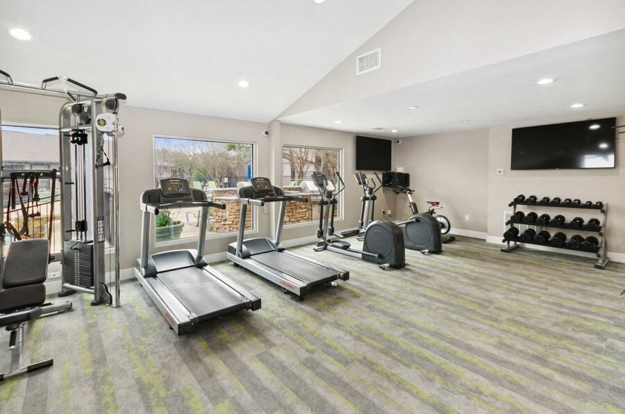 Fitness center with treadmills, stationary bikes and weights